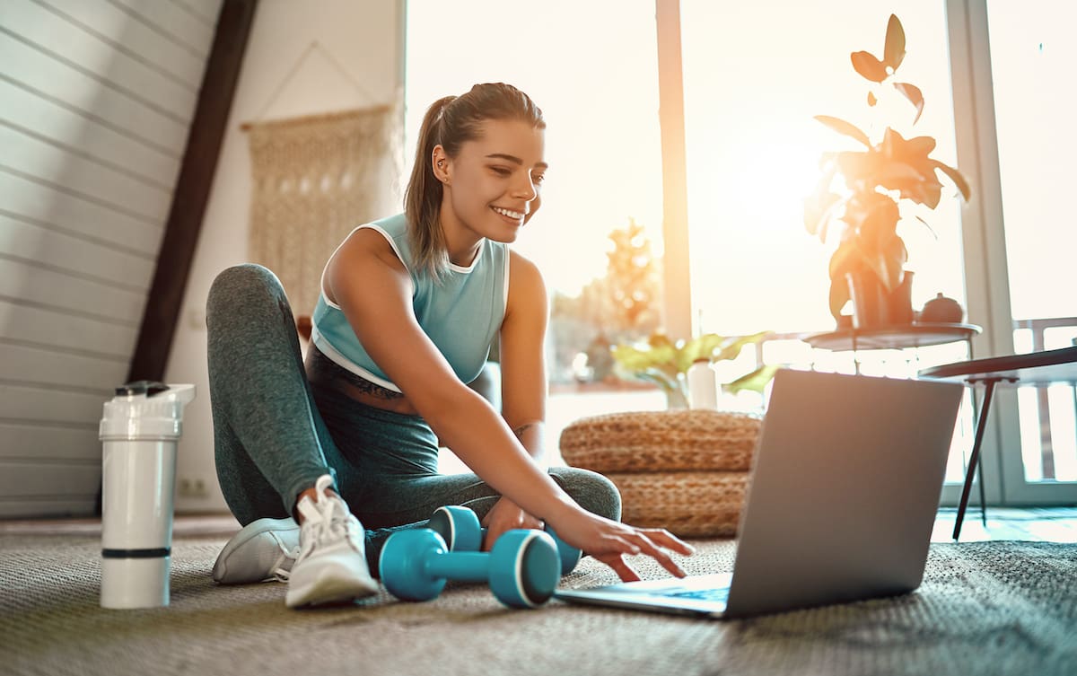 young woman exercising at home