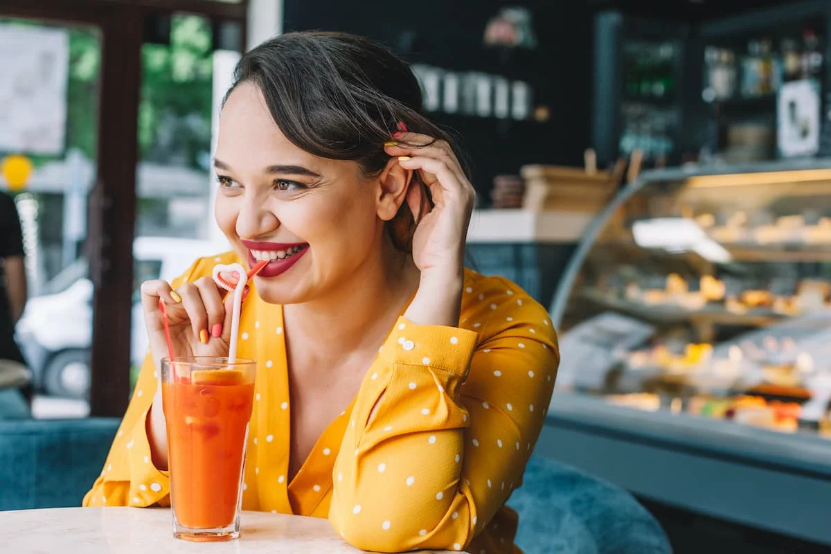 young healthy woman drinking a nutritious juice