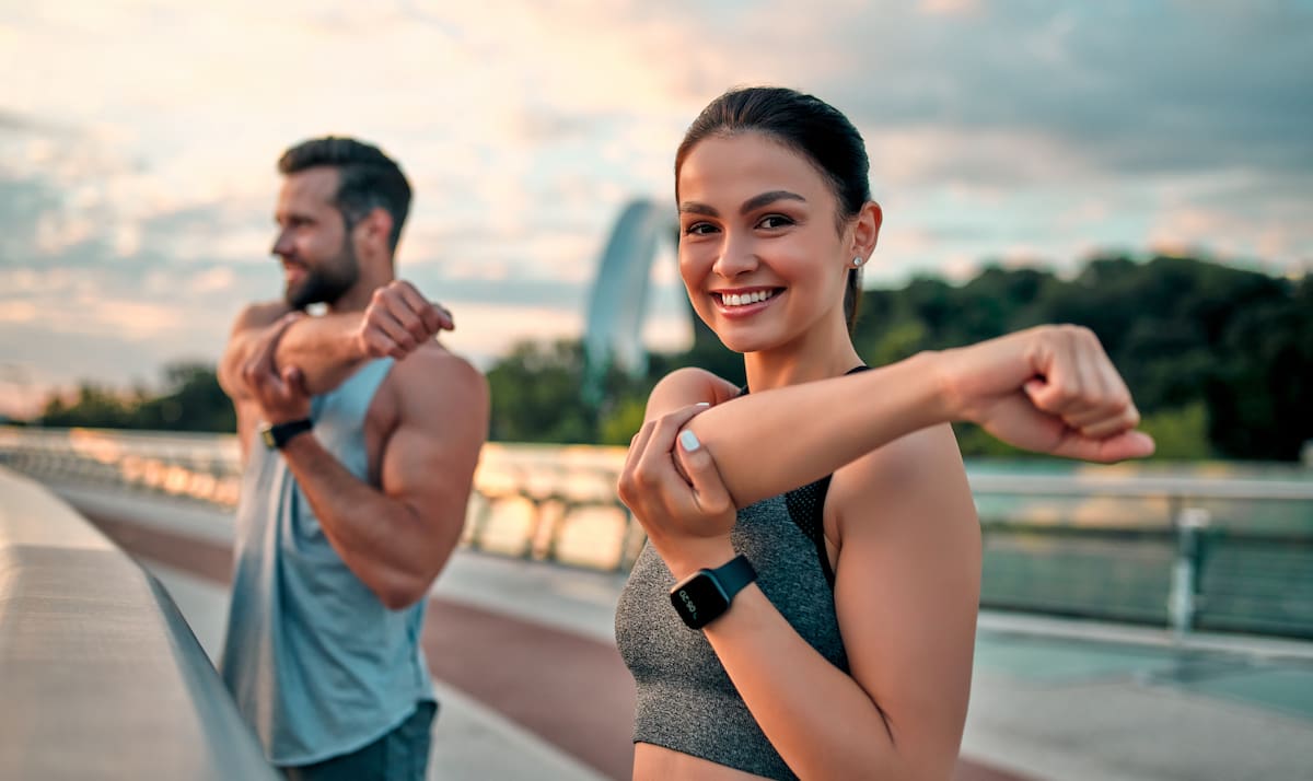 confident couple exercising outside