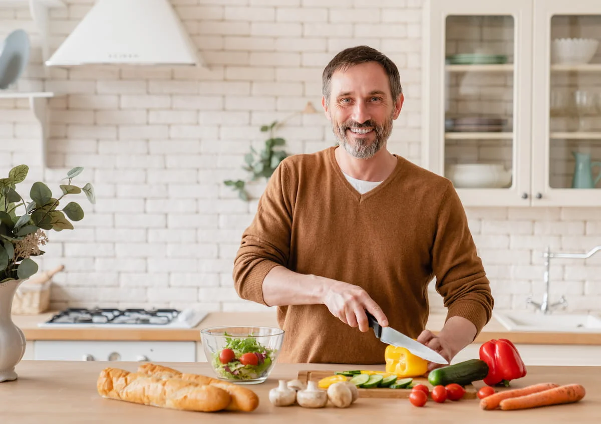 healthy man cooking a nutritious meal