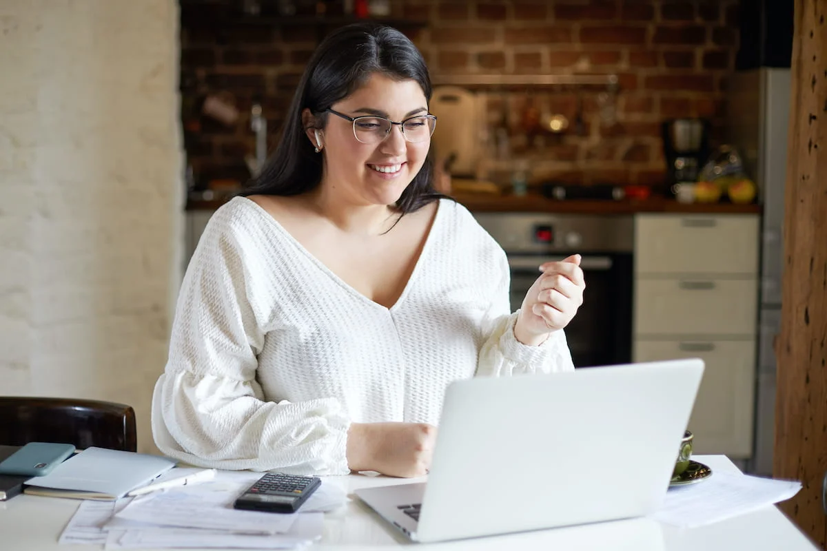 woman using laptop at home