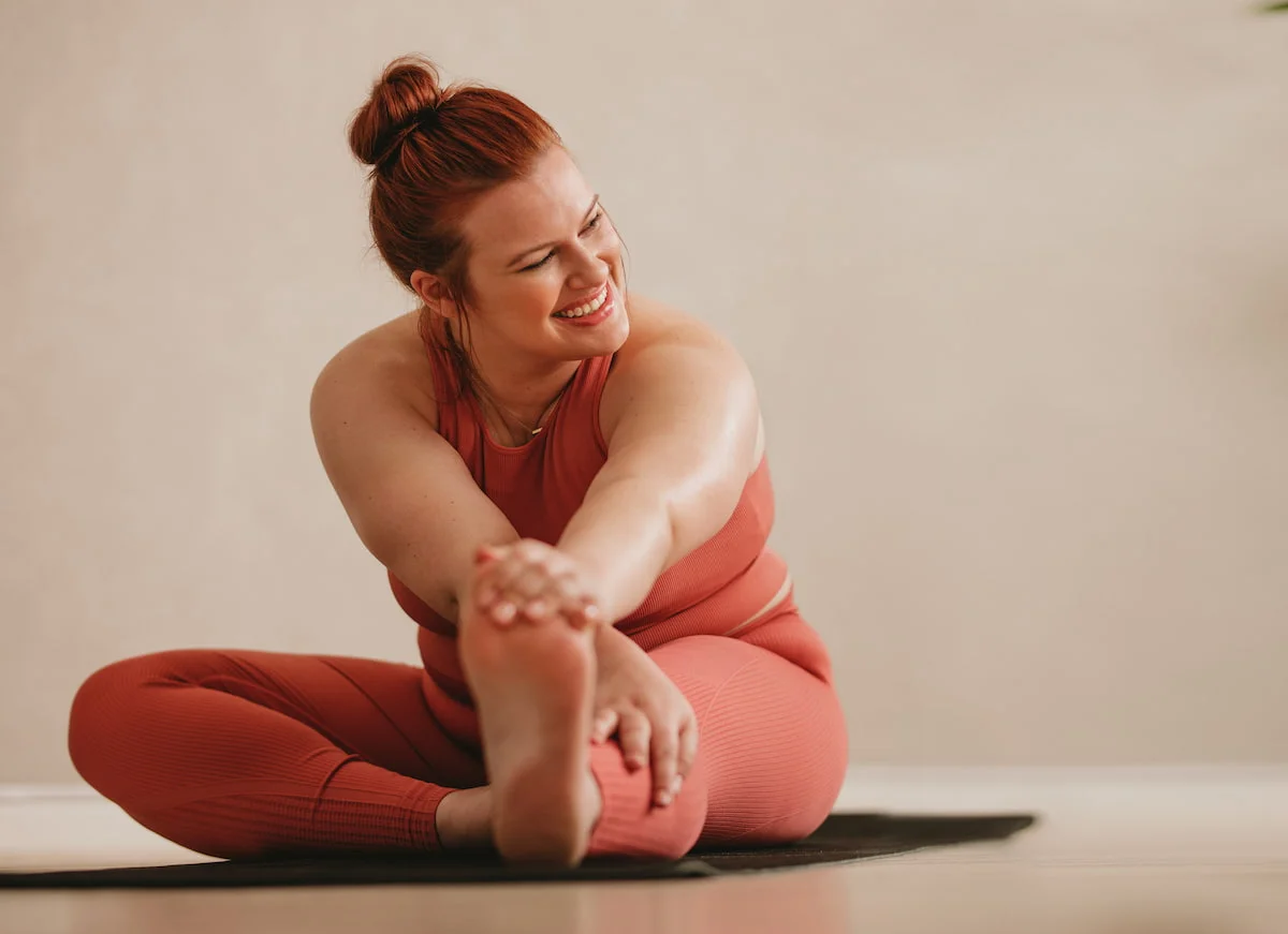 young healthy woman doing yoga at home