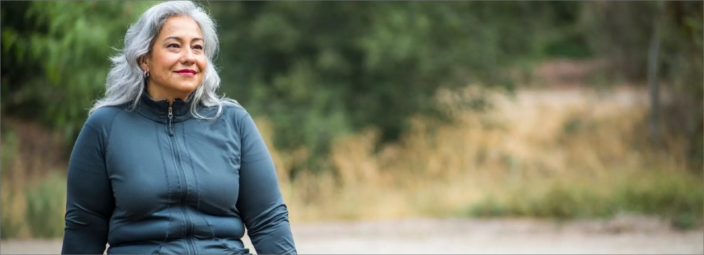 Happy woman sitting after a workout